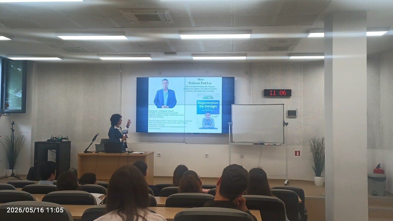 Professor Paul Lee being introduced on the lecture-hall screen, beside his book Regeneration by Design